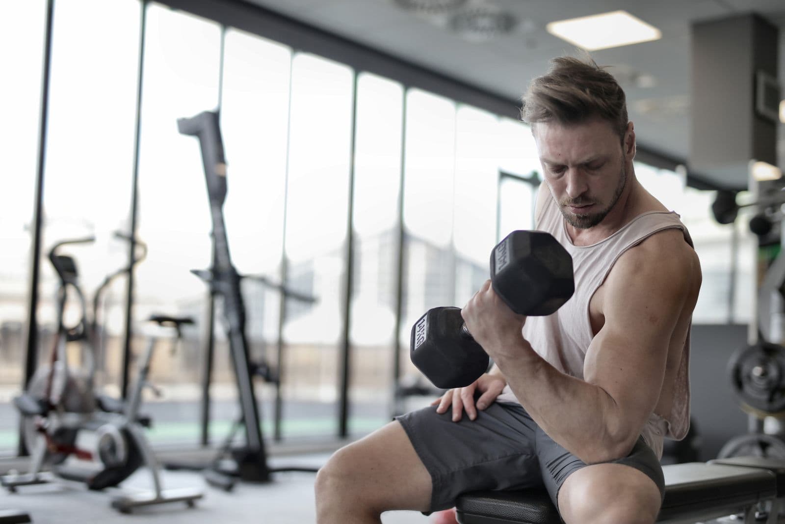 Jonas Krüger seated with a dumbbell during a conditioning session.